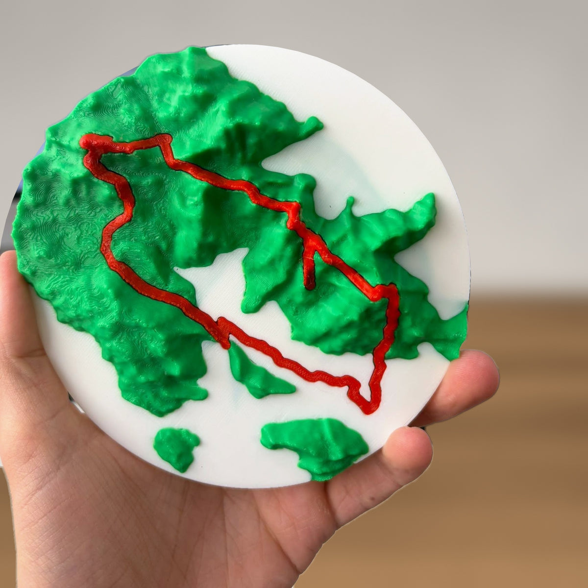 Close-up of the terrain disc held in a hand
